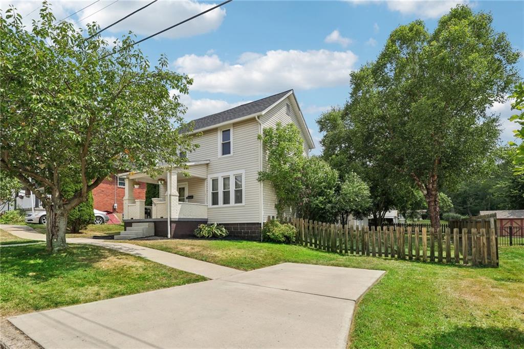 313 Pine Street Zelienople, PA 16063 - Photo 3 of 42 a front view of house with yard and green space
