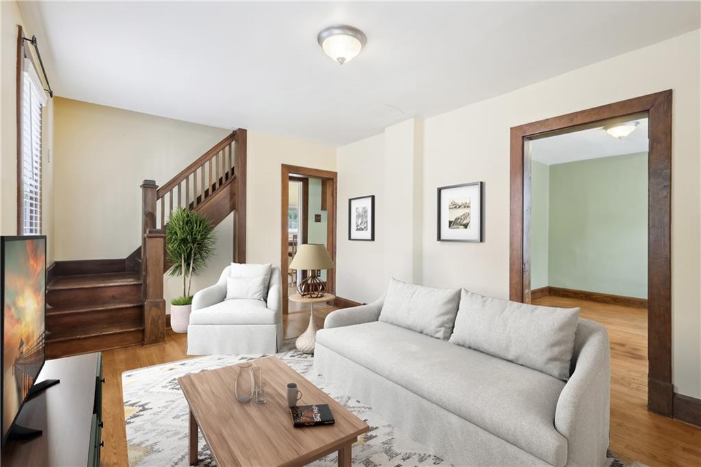 313 Pine Street Zelienople, PA 16063 - Photo 10 of 42 a living room with furniture and a potted plant