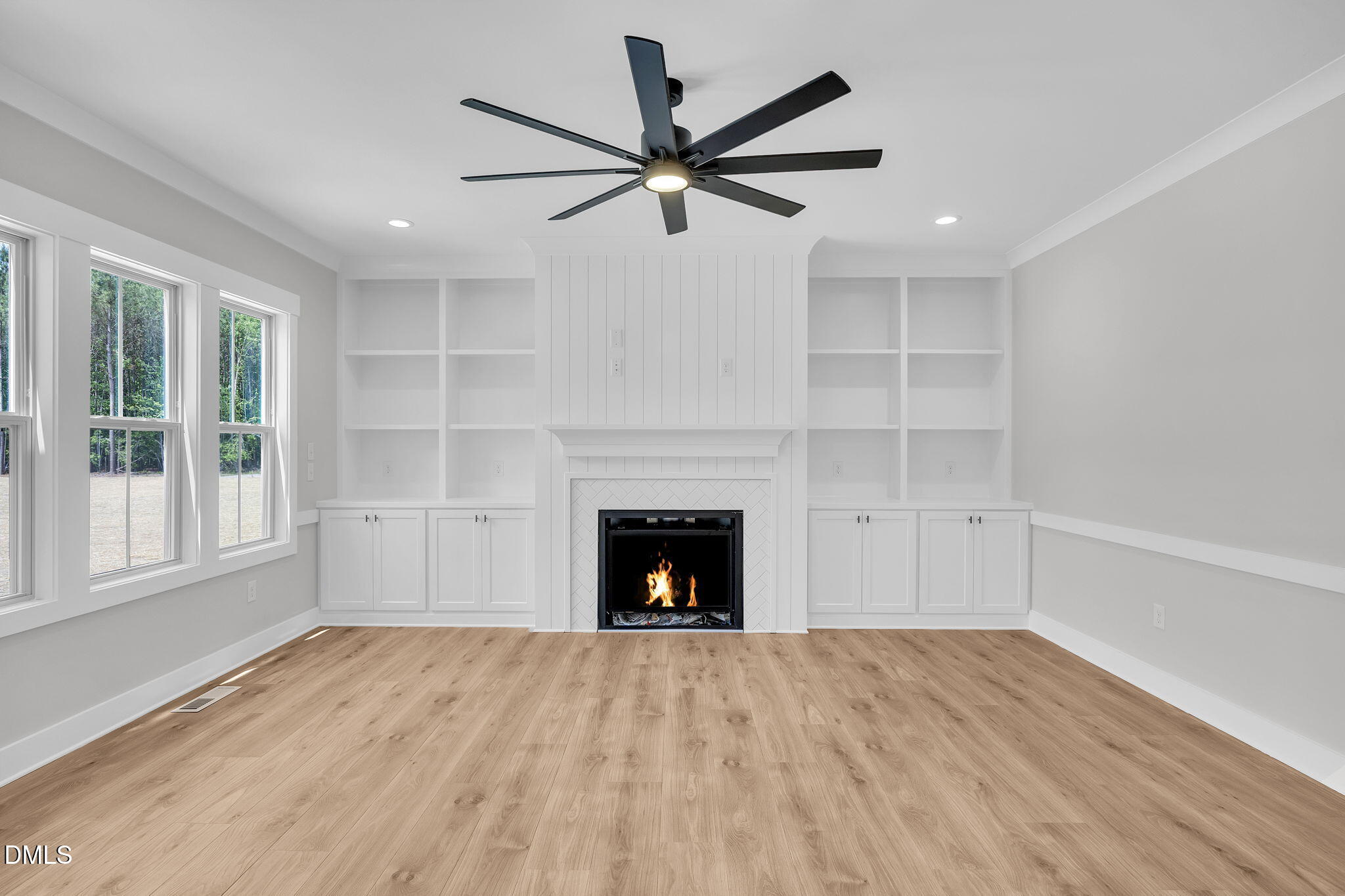 378 Freedom Ridge Drive Smithfield, NC 27577 - Photo 15 of 33 a view of empty room with wooden floor and fireplace