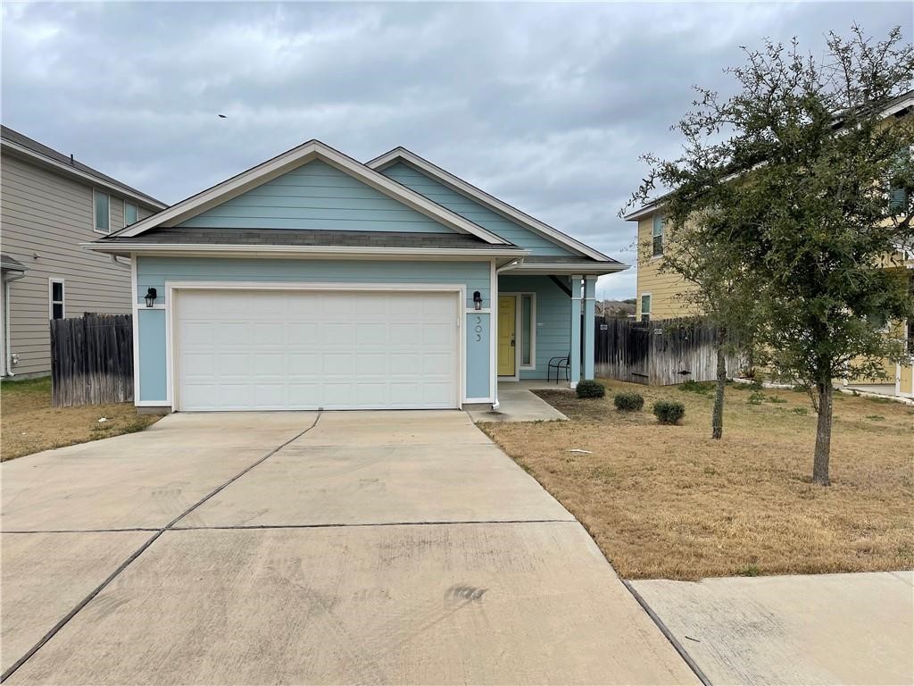 303 Eagle Brook Lane Buda, TX 78610 - Photo 1 of 1 a backyard of a house with seating space