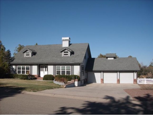 1806 Pony Soldier Road Prescott, AZ 86303 - Photo 1 of 9 a front view of a house with a yard
