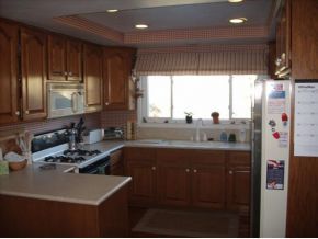 1806 Pony Soldier Road Prescott, AZ 86303 - Photo 5 of 9 a kitchen with stainless steel appliances a refrigerator a sink a stove a microwave and cabinets