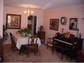 1806 Pony Soldier Road Prescott, AZ 86303 - Photo 8 of 9 a living room with furniture and a chandelier