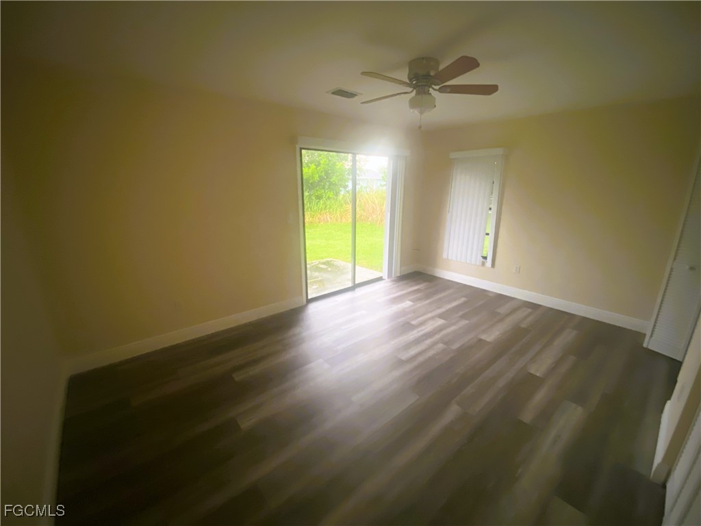 2247-2249 Violet Drive, Unit 2247 Fort Myers, FL 33905 - Photo 8 of 9 a view of an empty room with a window