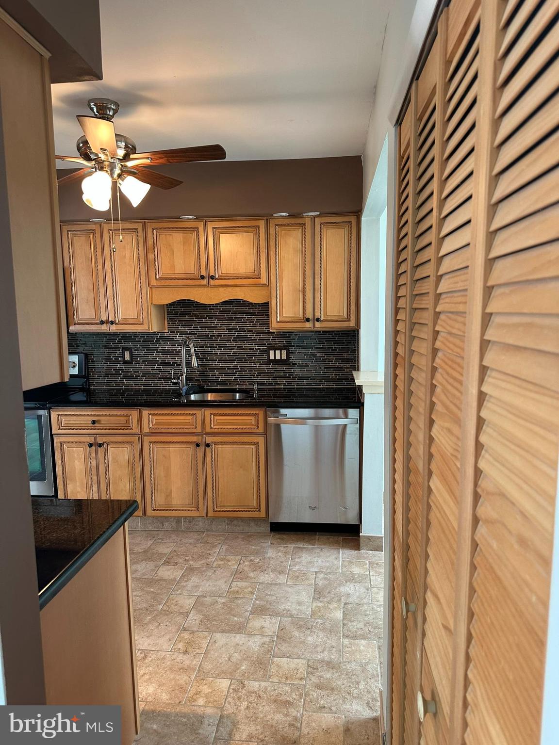 77 Kanabe Drive Westampton, NJ 08060 - Photo 11 of 30 a kitchen with granite countertop a sink a window and cabinets