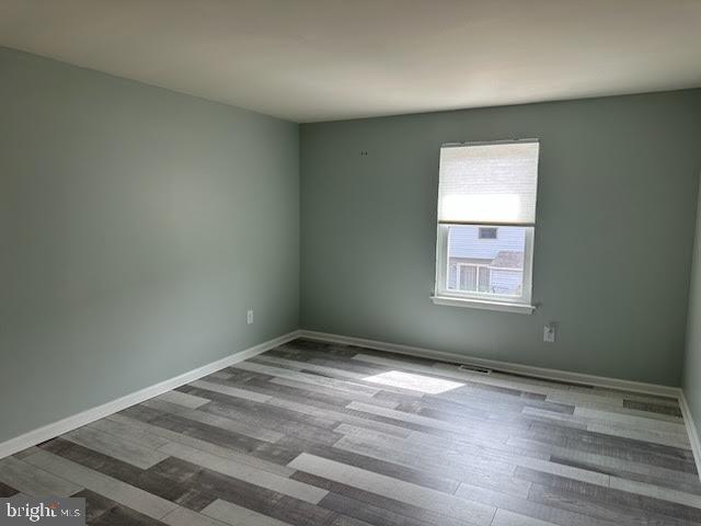 77 Kanabe Drive Westampton, NJ 08060 - Photo 16 of 30 an empty room with wooden floor and windows