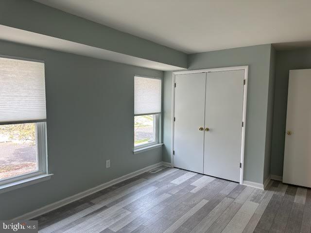 77 Kanabe Drive Westampton, NJ 08060 - Photo 23 of 30 a view of an empty room with wooden floor and a window
