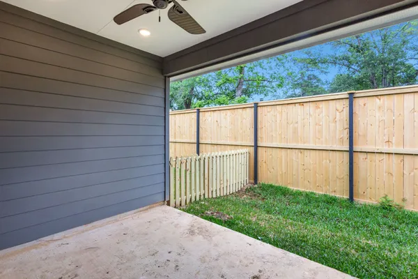 a view of a backyard with wooden floor