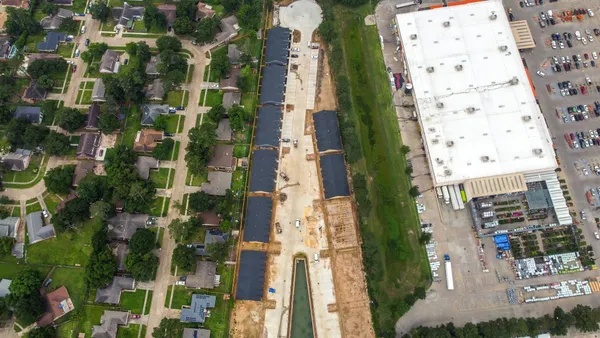 an aerial view of a house with outdoor space