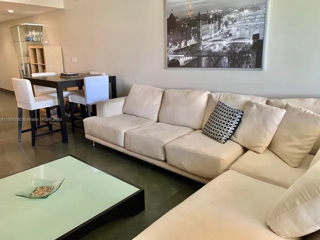 a bedroom with a bed and a night stand