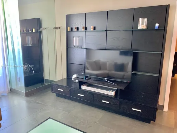 a bedroom with a bed and a walk in closet