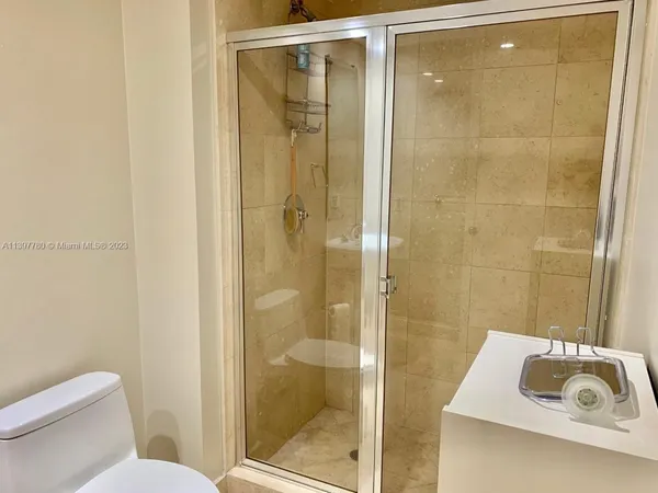 a view of swimming pool with seating space