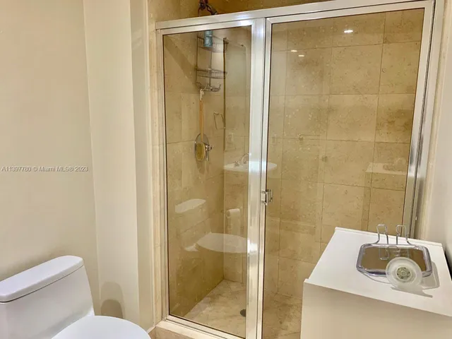 a view of swimming pool with seating space