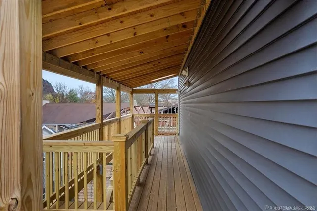 a view of balcony with wooden floor