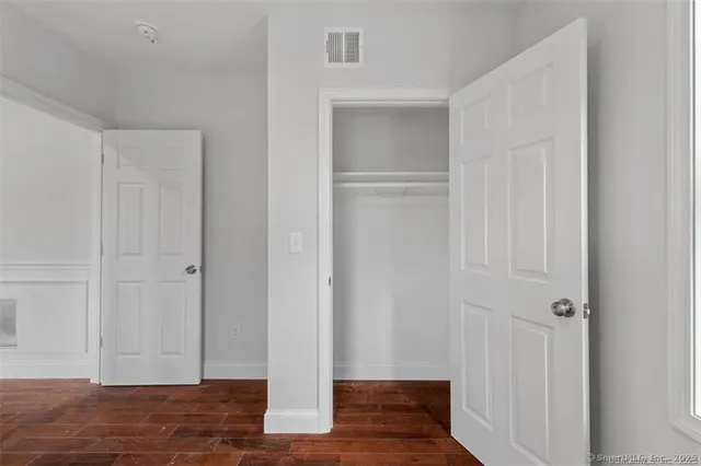 a view of a livingroom with wooden floor
