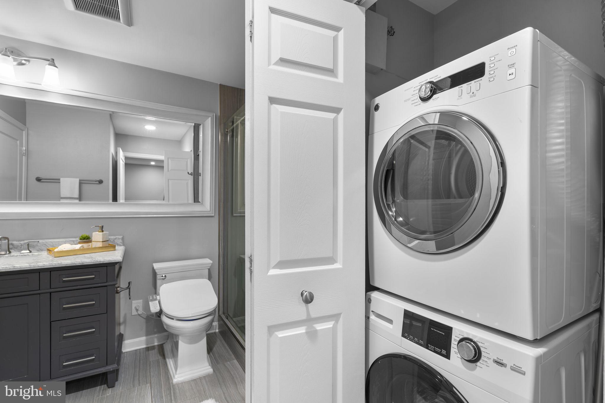 5575 Seminary Road, Unit 102 Falls Church, VA 22041 - Photo 16 of 31 a bathroom with a toilet sink and mirror