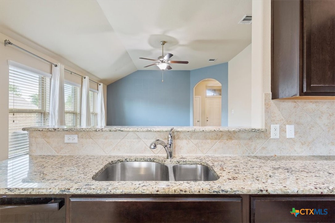 4019 Brookhaven Drive Temple, TX 76504 - Photo 13 of 25 a kitchen with granite countertop a sink a counter top space and cabinets
