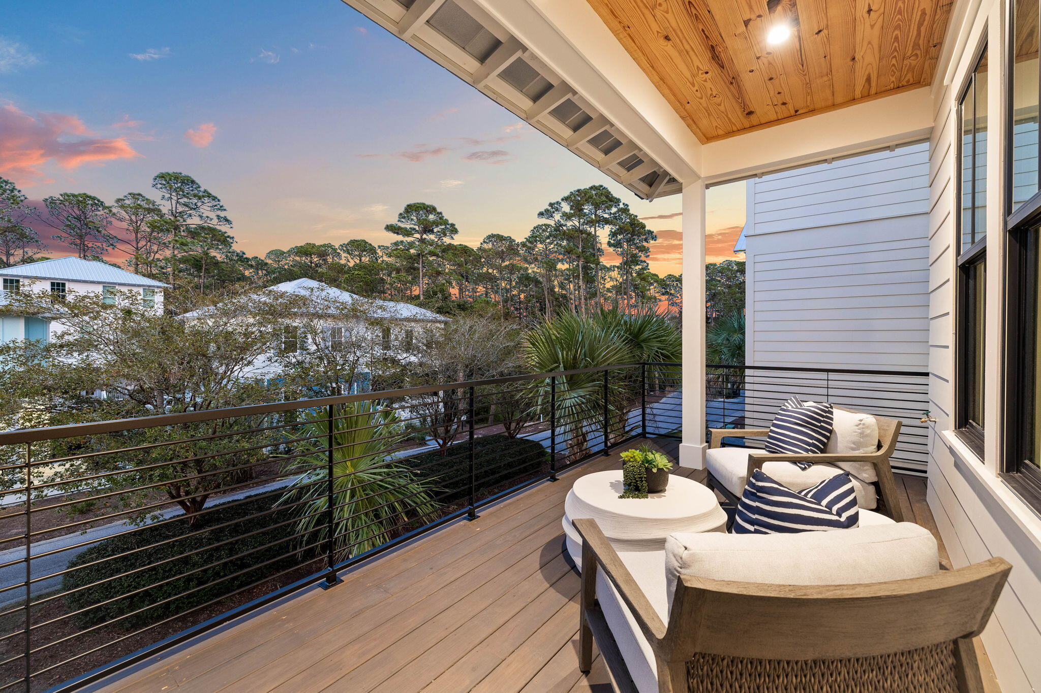 143 Redbud Ln Inlet Beach Inlet Beach, FL 32461 - Photo 20 of 62 a view of a balcony with chairs and a potted plant