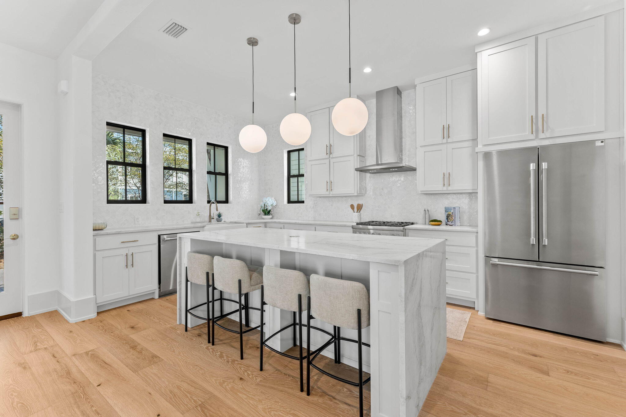 143 Redbud Ln Inlet Beach Inlet Beach, FL 32461 - Photo 6 of 62 a kitchen with kitchen island granite countertop a stove a sink a center island and a window