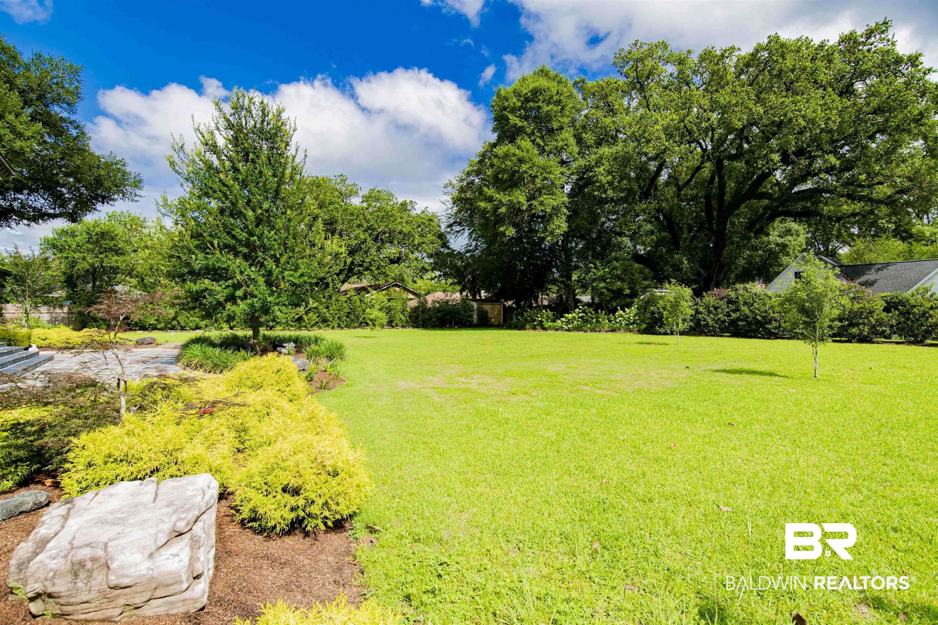 809 Bernard Circle Mobile, AL 36693 - Photo 46 of 75 Expansive lawn area featuring mature trees and established landscaping beds
