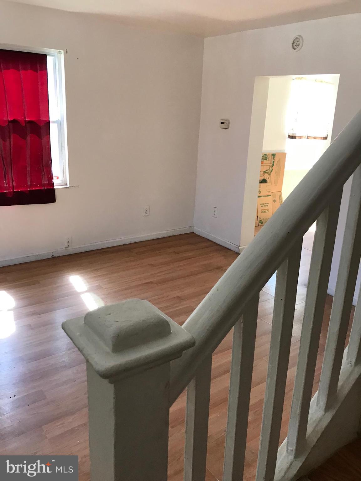 734 Roundview Road Baltimore, MD 21225 - Photo 13 of 22 Bottom of Staircase in Living room