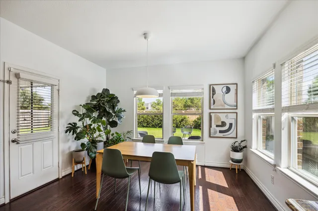 a view of a livingroom with furniture window and wooden floor