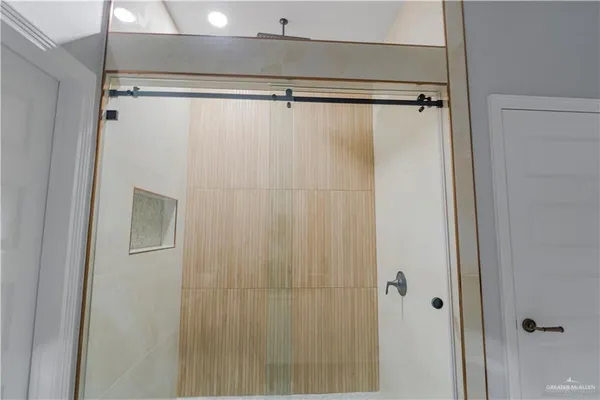 a bathroom with a shower and a shower curtain