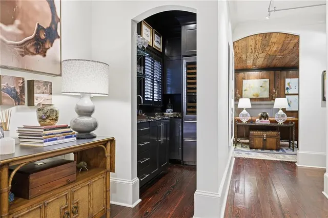 a view of hallway with livingroom and furniture