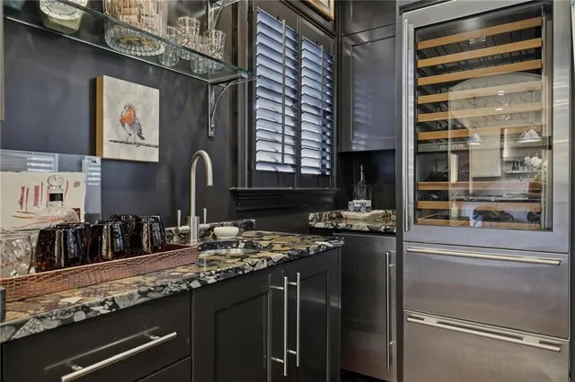 a kitchen with a refrigerator and a sink