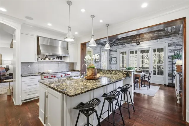a kitchen with a table and chairs in it