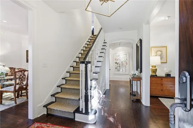 a view of entryway and hall with wooden floor