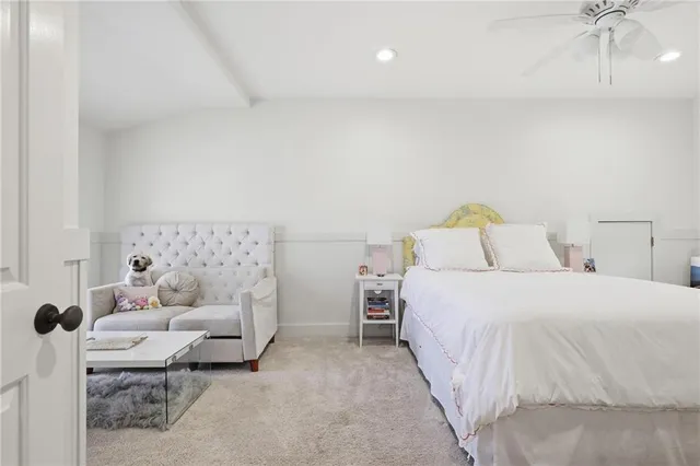 a bedroom with a bed and a couch