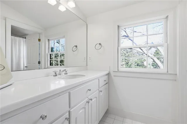 a bathroom with a sink and a large mirror