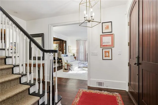 a view of a livingroom with furniture and staircase