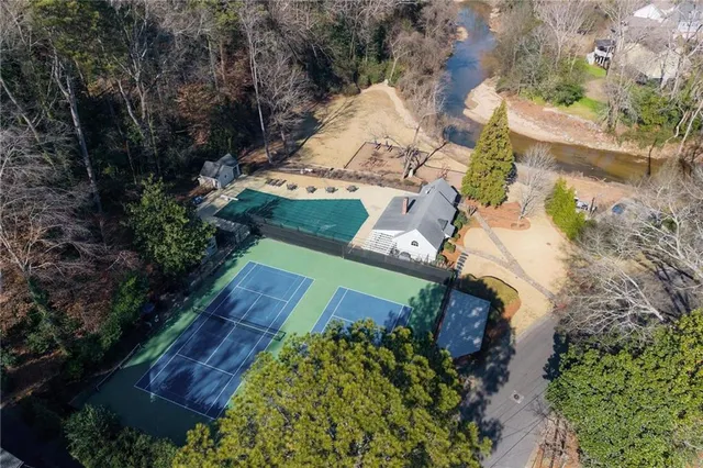 an aerial view of a house with a yard