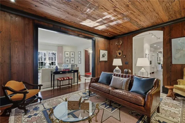 a living room with furniture and a dining table