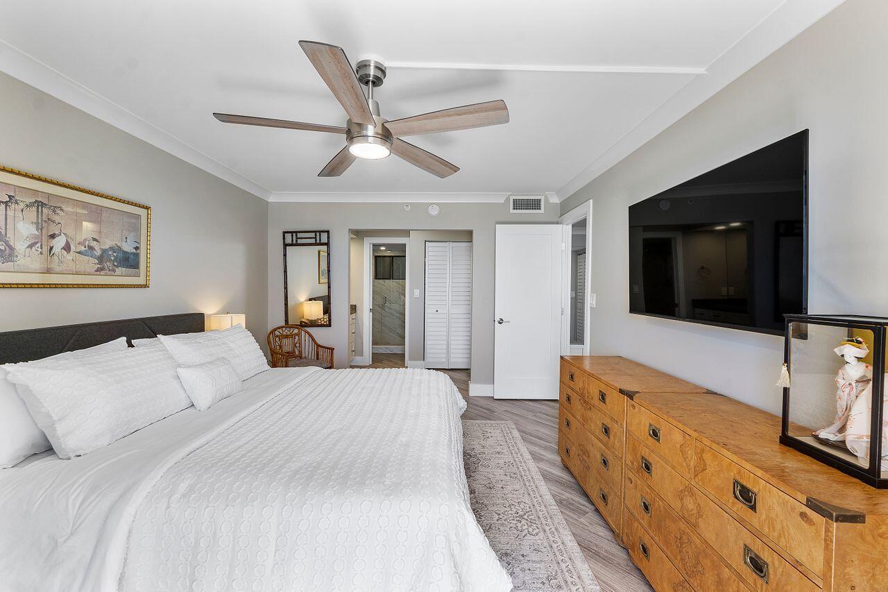 200 Ocean Trail Way, Unit 602 Jupiter, FL 33477 - Photo 19 of 50 a living room with furniture and a flat screen tv