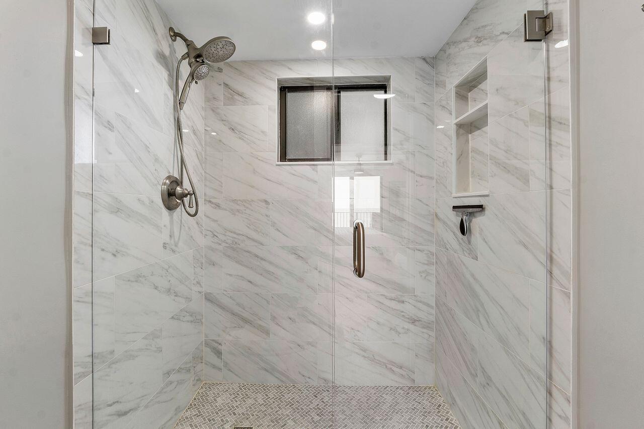 200 Ocean Trail Way, Unit 602 Jupiter, FL 33477 - Photo 21 of 50 a bathroom with a shower
