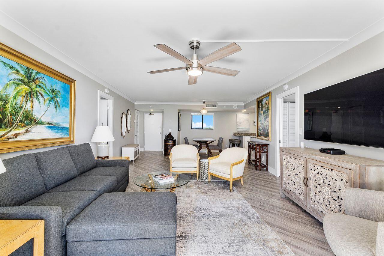 200 Ocean Trail Way, Unit 602 Jupiter, FL 33477 - Photo 5 of 50 a living room with furniture and a flat screen tv