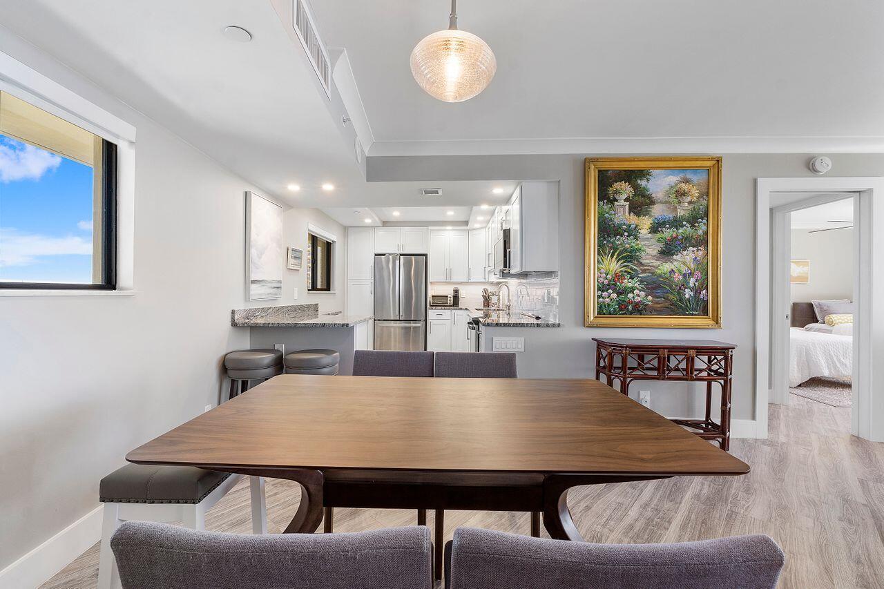 200 Ocean Trail Way, Unit 602 Jupiter, FL 33477 - Photo 7 of 50 a view of a dining room with furniture and window