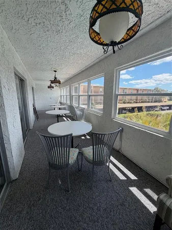 a room with gym equipment and windows