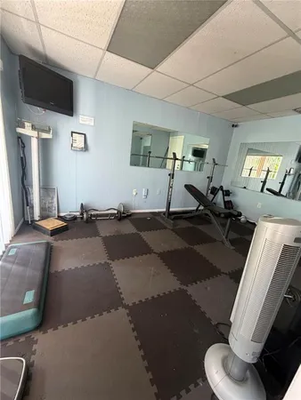 a view of swimming pool with outdoor seating and yard