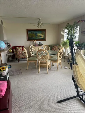 a view of a livingroom with furniture and windows