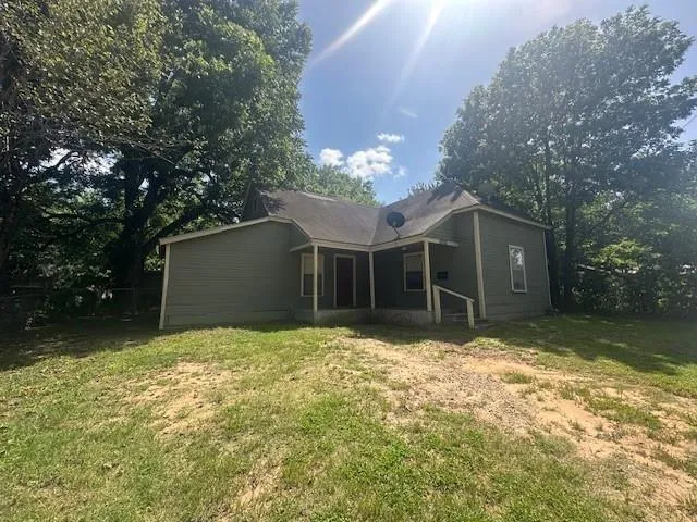 a house with yard in front of it