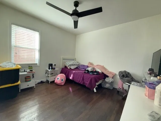 a bedroom with furniture and a window