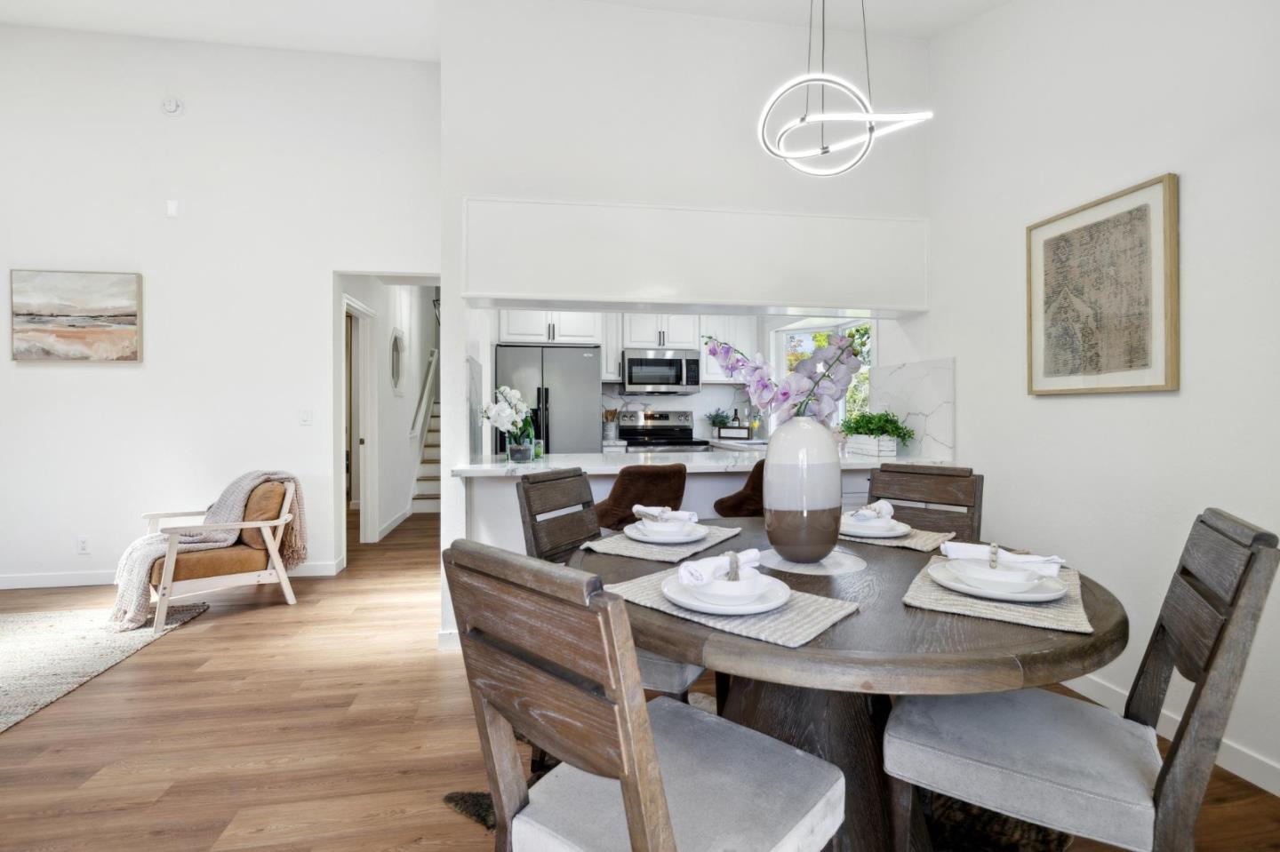 10892 Northfield Square Cupertino, CA 95014 - Photo 12 of 78 a view of a dining room with furniture wooden floor and chandelier
