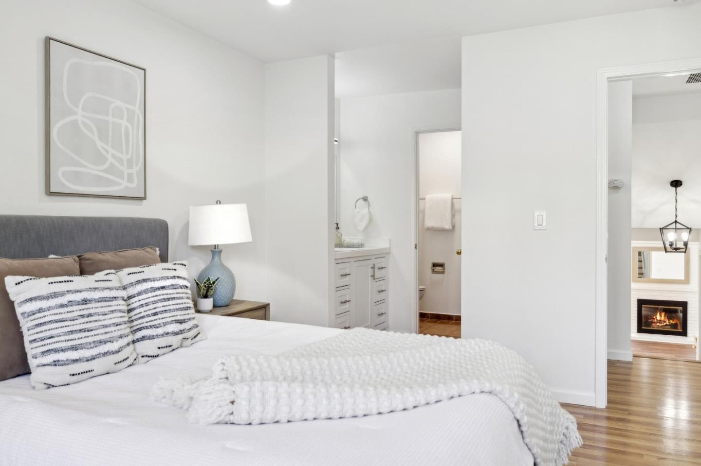 10892 Northfield Square Cupertino, CA 95014 - Photo 28 of 78 a bedroom with a bed and a lamp