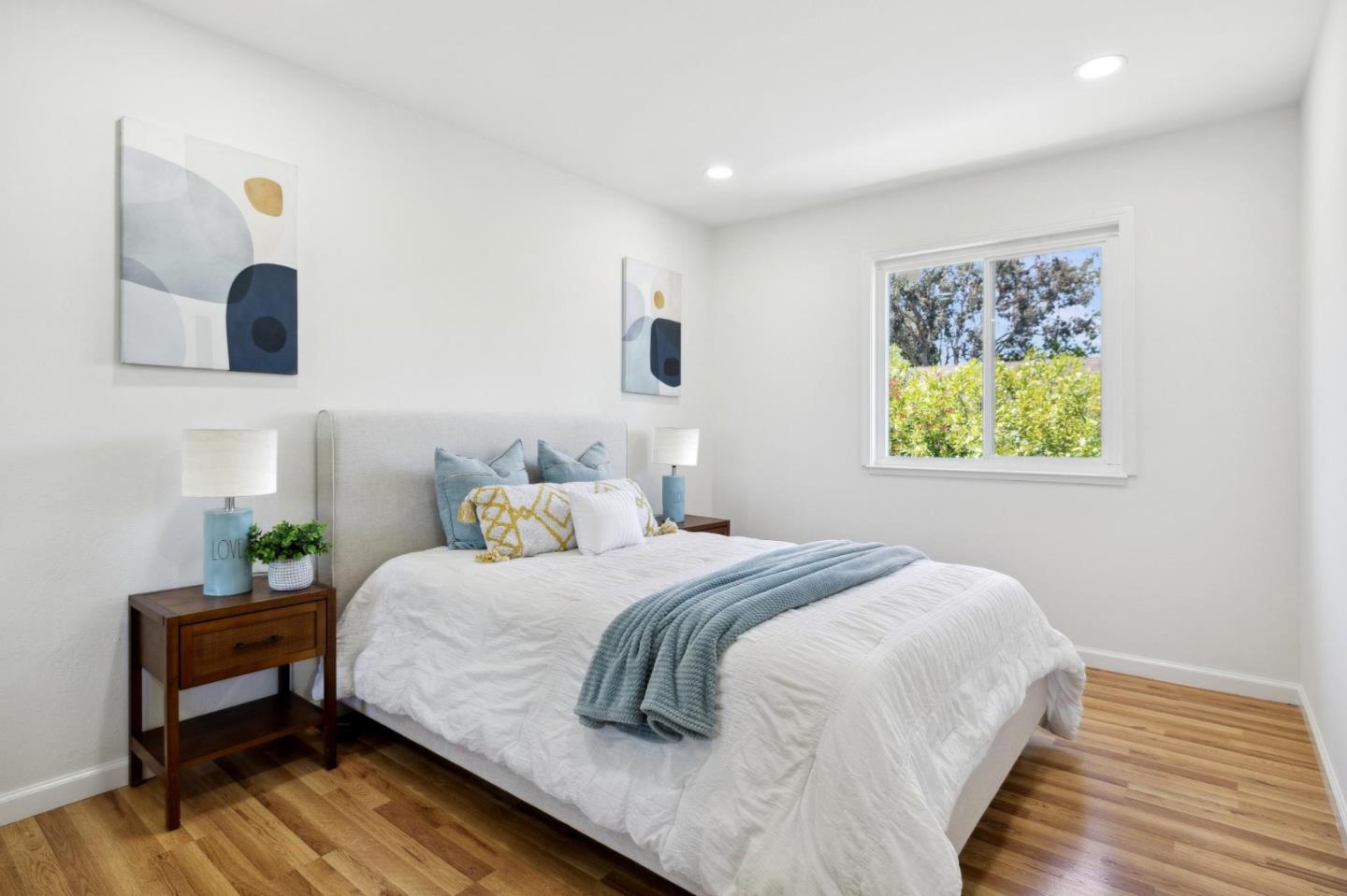 10892 Northfield Square Cupertino, CA 95014 - Photo 33 of 78 a bedroom with a bed and a lamp on table
