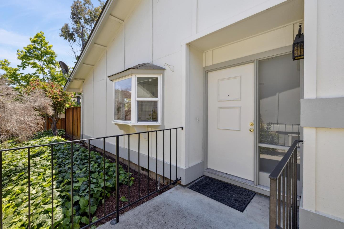 10892 Northfield Square Cupertino, CA 95014 - Photo 4 of 78 a view of a porch with wooden floor and fence