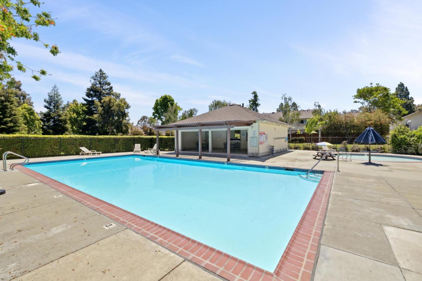 10892 Northfield Square Cupertino, CA 95014 - Photo 41 of 78 a view of a swimming pool with a lounge chairs
